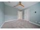 This bedroom boasts plush carpet, a ceiling fan, and easy access to hallway and closet at 5191 78Th St E Cir, Bradenton, FL 34203