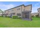 Exterior of a two-story townhome featuring a screened in lanai at 5191 78Th St E Cir, Bradenton, FL 34203