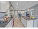 Bright kitchen with stainless steel appliances, granite countertops, and tiled floors at 5191 78Th St E Cir, Bradenton, FL 34203