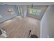Spacious, sun-filled living room with modern chandelier and new flooring at 5191 78Th St E Cir, Bradenton, FL 34203