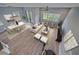 Open-concept living room and dining area with a modern chandelier and neutral color palette at 5191 78Th St E Cir, Bradenton, FL 34203