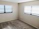 Inviting bedroom with plush carpeting and dual windows for plenty of natural light at 5439 3Rd E St, Bradenton, FL 34203