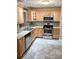 Bright eat-in kitchen with stainless steel appliances, tile backsplash, and ample counter space at 5439 3Rd E St, Bradenton, FL 34203