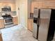 Well-lit kitchen featuring stainless steel appliances and maple cabinets and tile floors at 5439 3Rd E St, Bradenton, FL 34203