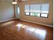 Bright living room with laminate flooring, and a large window at 5439 3Rd E St, Bradenton, FL 34203