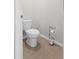 Cozy bathroom featuring a standard toilet and functional toilet paper holder at 5659 Woodland Sage Dr, Sarasota, FL 34238