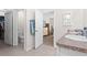 Bathroom featuring double sinks, and views of the bedroom and toilet at 5659 Woodland Sage Dr, Sarasota, FL 34238