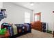 Cozy bedroom decorated with sports theme and bright natural light at 5659 Woodland Sage Dr, Sarasota, FL 34238