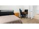 This bedroom features a desk and gaming chair at 5659 Woodland Sage Dr, Sarasota, FL 34238