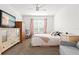 Spacious bedroom with large TV, ceiling fan and large window at 5659 Woodland Sage Dr, Sarasota, FL 34238