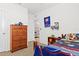 This sports-themed bedroom is enhanced with plenty of storage space at 5659 Woodland Sage Dr, Sarasota, FL 34238
