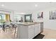 Kitchen island with seating, stainless dishwasher, and pendant lighting at 5659 Woodland Sage Dr, Sarasota, FL 34238