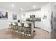 Open concept kitchen with island, granite countertops, and seating at 5659 Woodland Sage Dr, Sarasota, FL 34238