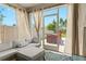 Enclosed lanai with comfortable seating and sliding doors to backyard at 5659 Woodland Sage Dr, Sarasota, FL 34238