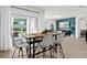Dining and living area with sliding glass doors to outdoor patio at 5659 Woodland Sage Dr, Sarasota, FL 34238