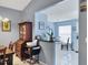 Dining room features an antique hutch and a pass-through into the breakfast nook and kitchen beyond at 5823 Helen Way, Sarasota, FL 34243