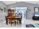 Open-concept dining room flows into kitchen and living area, great for entertaining guests at 5823 Helen Way, Sarasota, FL 34243