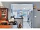 Open kitchen with stainless steel appliances and ample counter space at 5823 Helen Way, Sarasota, FL 34243