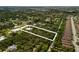 Secluded property nestled amidst mature trees and lush landscapes, accessible via a long private driveway at 601 Suffolk Cir, Nokomis, FL 34275