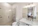 Modern bathroom featuring a glass-enclosed shower, a vanity with a white countertop, and updated fixtures at 601 Suffolk Cir, Nokomis, FL 34275