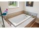 Close-up of a built-in bathtub with a sleek design and a modern faucet, creating a relaxing atmosphere at 601 Suffolk Cir, Nokomis, FL 34275