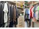 Spacious closet with custom shelving and drawers, providing ample storage space for clothing and accessories at 601 Suffolk Cir, Nokomis, FL 34275