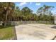 Open driveway with lush, tropical landscaping, perfect for parking at 601 Suffolk Cir, Nokomis, FL 34275