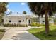 Stunning home exterior featuring meticulous landscaping, a clean driveway, and a well-designed facade at 601 Suffolk Cir, Nokomis, FL 34275