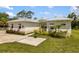 Beautiful home exterior showcasing clean lines, pristine landscaping, and a well-maintained yard with ample curb appeal at 601 Suffolk Cir, Nokomis, FL 34275