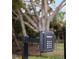 Close-up of a gate lockbox, providing convenient and secure access to the property at 601 Suffolk Cir, Nokomis, FL 34275