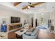 Inviting living room with wood beam ceilings, cozy fireplace, comfortable seating, and elegant decor creating a relaxing atmosphere at 601 Suffolk Cir, Nokomis, FL 34275