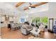Open-concept living area with seamless kitchen, cozy seating, and scenic views creating an inviting space for entertaining and relaxation at 601 Suffolk Cir, Nokomis, FL 34275