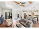 Open concept living space with views into the kitchen and foyer and with beam ceilings creating an expansive atmosphere at 601 Suffolk Cir, Nokomis, FL 34275