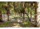 Image of fenced perimeter with lush landscaping on property at 601 Suffolk Cir, Nokomis, FL 34275
