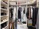 Organized walk-in closet offering ample hanging and shelving space for clothing and accessories at 601 Suffolk Cir, Nokomis, FL 34275