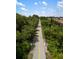 Scenic walking path surrounded by lush greenery, perfect for enjoying nature and outdoor exercise at 601 Suffolk Cir, Nokomis, FL 34275