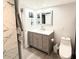 Updated bathroom with modern vanity, gray color scheme and sleek finishes at 6400 46Th N Ave # 113, Kenneth City, FL 33709