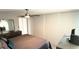 Cozy bedroom featuring ceiling fan, mirrored closet doors, and modern furnishings at 6400 46Th N Ave # 113, Kenneth City, FL 33709