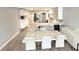 Open concept living with a dining area featuring sleek modern design and finishes at 6400 46Th N Ave # 113, Kenneth City, FL 33709