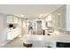 Bright kitchen features stainless steel appliances, updated cabinets, and quartz countertops at 6400 46Th N Ave # 113, Kenneth City, FL 33709