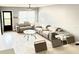Inviting living room with modern furniture, light tile flooring, and plenty of natural light at 6400 46Th N Ave # 113, Kenneth City, FL 33709