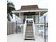 Community recreation center featuring an elevated deck overlooking a pool at 6400 46Th N Ave # 113, Kenneth City, FL 33709