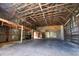 Expansive barn interior with a sturdy wooden framework and abundant open space at 6923 13Th E Ave, Bradenton, FL 34208