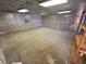 Large unfinished basement with concrete floors and insulation, offering potential for customization at 6923 13Th E Ave, Bradenton, FL 34208