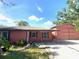 Front view of a cozy single-story home with a brick porch and extra garage at 6923 13Th E Ave, Bradenton, FL 34208