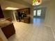 Kitchen with stainless steel appliances and breakfast area, flooded with natural light at 6923 13Th E Ave, Bradenton, FL 34208