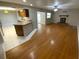 Open-concept living space showcasing the kitchen, living room, and hardwood flooring at 6923 13Th E Ave, Bradenton, FL 34208