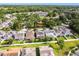 An aerial view shows a neat backyard and residential neighborhood with mature trees at 7113 Park Tree Dr, Tampa, FL 33625