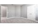 Spacious bedroom features neutral gray walls, carpet, and a double door closet at 7113 Park Tree Dr, Tampa, FL 33625