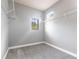 Walk-in closet featuring carpet, wire shelving, and a small window for natural light at 7113 Park Tree Dr, Tampa, FL 33625